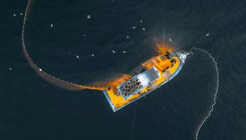 Drone view of fishing trawler on sea